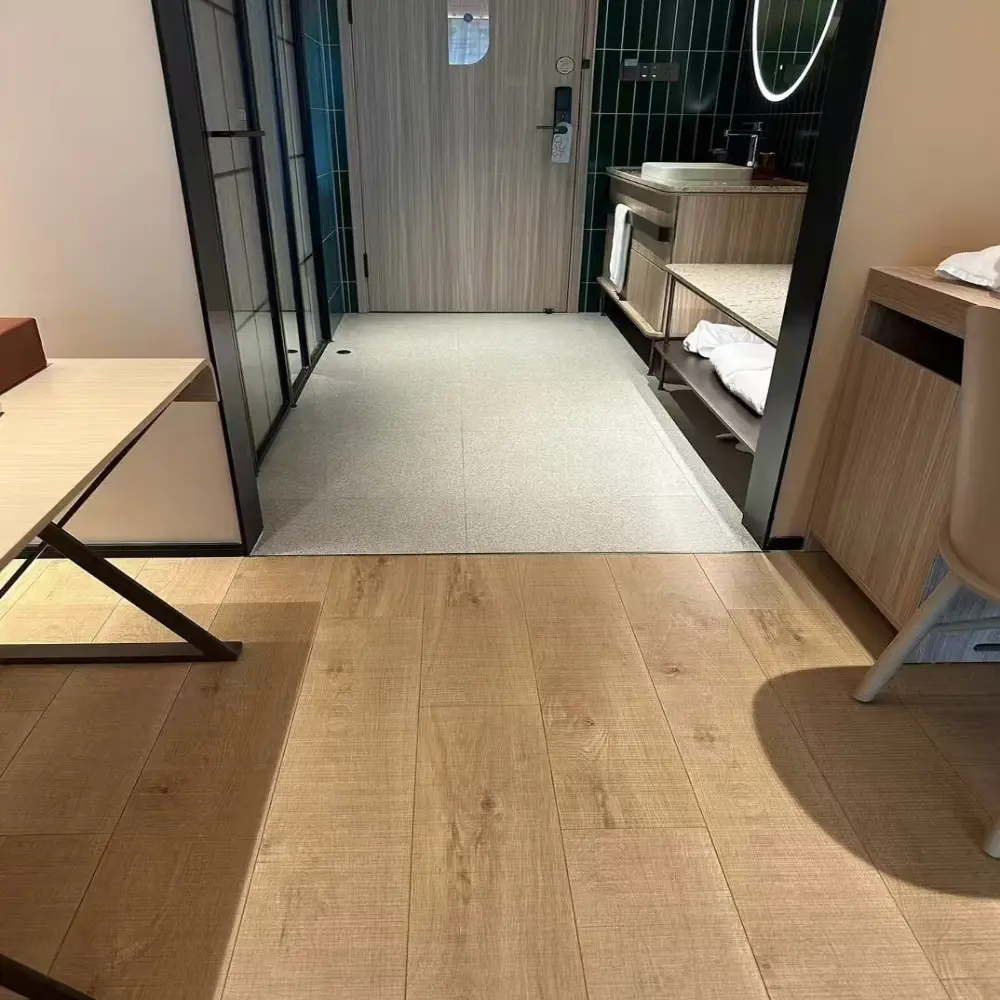 Close-up of distressed oak SPC flooring in Shanghai hotel room